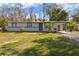 Charming single-story home with a spacious front yard and covered carport at 306 Midwood Dr, Plant City, FL 33566