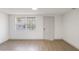 Bright living room with modern flooring, fresh paint, and natural light at 306 Midwood Dr, Plant City, FL 33566