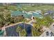 Aerial view of the community clubhouse, showcasing the golf course and lush landscaping at 3092 Osprey Ln, Clearwater, FL 33762