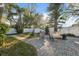 Relax on the brick paver patio in this lush backyard, perfect for outdoor entertaining at 3092 Osprey Ln, Clearwater, FL 33762