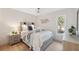 Bedroom with ceiling fan, light wood flooring, and a window at 3092 Osprey Ln, Clearwater, FL 33762