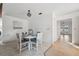 Cozy dining area featuring a round table with stylish seating, adjacent to the home's bright entry at 3092 Osprey Ln, Clearwater, FL 33762