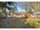 This home boasts a large backyard with mature landscaping and a tranquil setting at 3092 Osprey Ln, Clearwater, FL 33762