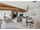 Open-concept living room features a stone fireplace and vaulted wood ceilings, creating a warm and inviting atmosphere at 3092 Osprey Ln, Clearwater, FL 33762