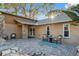 Spacious paved patio ideal for outdoor entertaining, enhanced by stone accents and comfortable seating at 3092 Osprey Ln, Clearwater, FL 33762