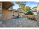 Secluded outdoor patio with paver flooring, comfortable seating and a tranquil garden feature, perfect for relaxation at 3092 Osprey Ln, Clearwater, FL 33762