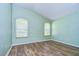 This cozy bedroom has vaulted ceiling, two windows and hardwood floors at 3133 Beaver Pond Trl, Valrico, FL 33596