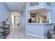 Open-concept entryway showcasing the kitchen area and bright natural light at 3133 Beaver Pond Trl, Valrico, FL 33596