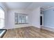 Open living space with decorative molding and a large bay window overlooking the front yard at 3133 Beaver Pond Trl, Valrico, FL 33596