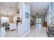 Bright, open-concept living space flowing from kitchen to living room, with tile flooring and neutral paint at 3133 Beaver Pond Trl, Valrico, FL 33596