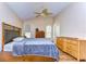 This room has vaulted ceilings, hardwood floors, and a large bedroom set at 3133 Beaver Pond Trl, Valrico, FL 33596