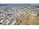 An aerial shows a vibrant and well-maintained residential community with winding roads and scenic water features at 334 Club Manor Dr, Sun City Center, FL 33573