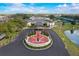 Aerial view of Sun City Center Veterans Memorial, a building with flags and manicured landscaping at 334 Club Manor Dr, Sun City Center, FL 33573