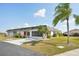 Charming single-story home with a well-maintained lawn and driveway, showcasing its inviting curb appeal at 334 Club Manor Dr, Sun City Center, FL 33573