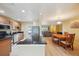 Kitchen with stainless appliances, granite counters, and wood cabinets at 334 Club Manor Dr, Sun City Center, FL 33573