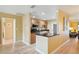 Open concept kitchen with granite countertops and wood cabinets at 334 Club Manor Dr, Sun City Center, FL 33573