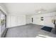 Large, enclosed lanai features a ceiling fan, storage, and convenient access to the exterior at 334 Club Manor Dr, Sun City Center, FL 33573