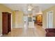 Open living room with wood floors leading to the kitchen and dining areas at 334 Club Manor Dr, Sun City Center, FL 33573