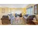 Bright living room with comfortable seating, natural light, and a welcoming ambiance at 334 Club Manor Dr, Sun City Center, FL 33573