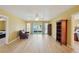 Spacious living room with wood floors and sliding glass doors leading to the patio at 334 Club Manor Dr, Sun City Center, FL 33573
