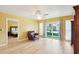 Living room featuring wood floors and sliding glass doors leading to the patio at 334 Club Manor Dr, Sun City Center, FL 33573