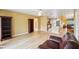 Open living room with wood floors leading to the kitchen and dining areas at 334 Club Manor Dr, Sun City Center, FL 33573