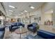 Lobby sitting area with comfortable seating, area rug, coffee table, and tile flooring throughout at 334 Club Manor Dr, Sun City Center, FL 33573
