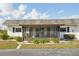 Exterior view showcasing the screened-in lanai, perfect for enjoying the outdoors at 334 Club Manor Dr, Sun City Center, FL 33573