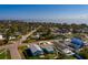 Coastal community with charming homes from above, and ocean views in the background at 3774 Arkansas Ne Ave, St Petersburg, FL 33703