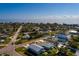 Aerial view of homes close to the water, in a coastal community under a bright blue sky at 3774 Arkansas Ne Ave, St Petersburg, FL 33703