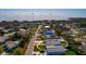 Coastal community with nearby water views from above under a sky of scattered clouds at 3774 Arkansas Ne Ave, St Petersburg, FL 33703