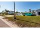Charming turquoise home with mature trees and a long front lawn at 3774 Arkansas Ne Ave, St Petersburg, FL 33703