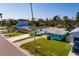 Exterior street view of the home showing the front yard and charming curb appeal at 3774 Arkansas Ne Ave, St Petersburg, FL 33703