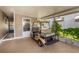 Covered carport area showcasing a golf cart, offering convenient parking and storage at 37841 Mission Hills Ave, Zephyrhills, FL 33541