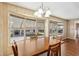Bright dining area with a table for four, featuring multiple windows at 37841 Mission Hills Ave, Zephyrhills, FL 33541