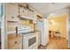 Well-maintained kitchen featuring classic white appliances, light wood cabinetry at 37841 Mission Hills Ave, Zephyrhills, FL 33541