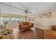 Relaxing living room offers laminate floors, lots of natural light and neutral paint to provide a calm space at 37841 Mission Hills Ave, Zephyrhills, FL 33541
