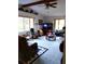 Bright living room featuring large windows, cozy seating, and a ceiling fan at 39349 & 39343 Rusbe Dr, Zephyrhills, FL 33540