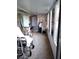 Bright sunroom featuring lots of natural light through a series of large windows at 39349 & 39343 Rusbe Dr, Zephyrhills, FL 33540