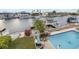 Waterfront home with a pool, dock, and boat lift, offering easy access to the water at 4195 Des Prez Ct, Hernando Beach, FL 34607