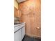 Unique bathroom featuring wood paneling and vintage nautical decor at 4408 W Lackland Pl, Tampa, FL 33616