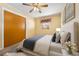 This virtually staged bedroom features a large closet and ceiling fan at 4408 W Lackland Pl, Tampa, FL 33616