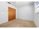 This bedroom features a closet, neutral walls, and carpet at 4408 W Lackland Pl, Tampa, FL 33616