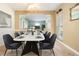 Charming dining room with modern table set, open view to living space and bright natural light at 4408 W Lackland Pl, Tampa, FL 33616