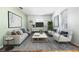 Spacious living area with a large rug, contemporary decor, and ample natural light from the window at 4408 W Lackland Pl, Tampa, FL 33616