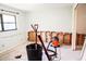 Bedroom in need of renovation with damaged drywall and a trash receptacle at 4609 W San Miguel St, Tampa, FL 33629