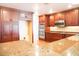 Kitchen boasts custom wood cabinets, stainless steel appliances, and granite countertops, awaiting your personal touches at 4609 W San Miguel St, Tampa, FL 33629