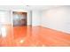 Spacious living room featuring gleaming hardwood floors and a double door entry, ready for personalization at 4609 W San Miguel St, Tampa, FL 33629