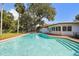 Backyard pool with steps and a surrounding brick patio, enhancing outdoor living at 4609 W San Miguel St, Tampa, FL 33629