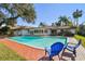 Backyard pool with a brick patio and furniture, perfect for outdoor lounging at 4609 W San Miguel St, Tampa, FL 33629